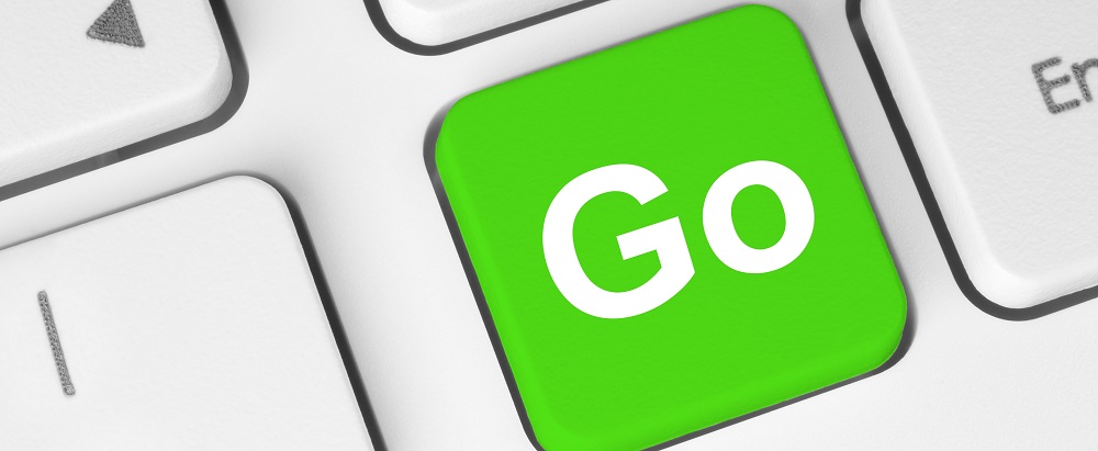 computer key with the word "go" in green