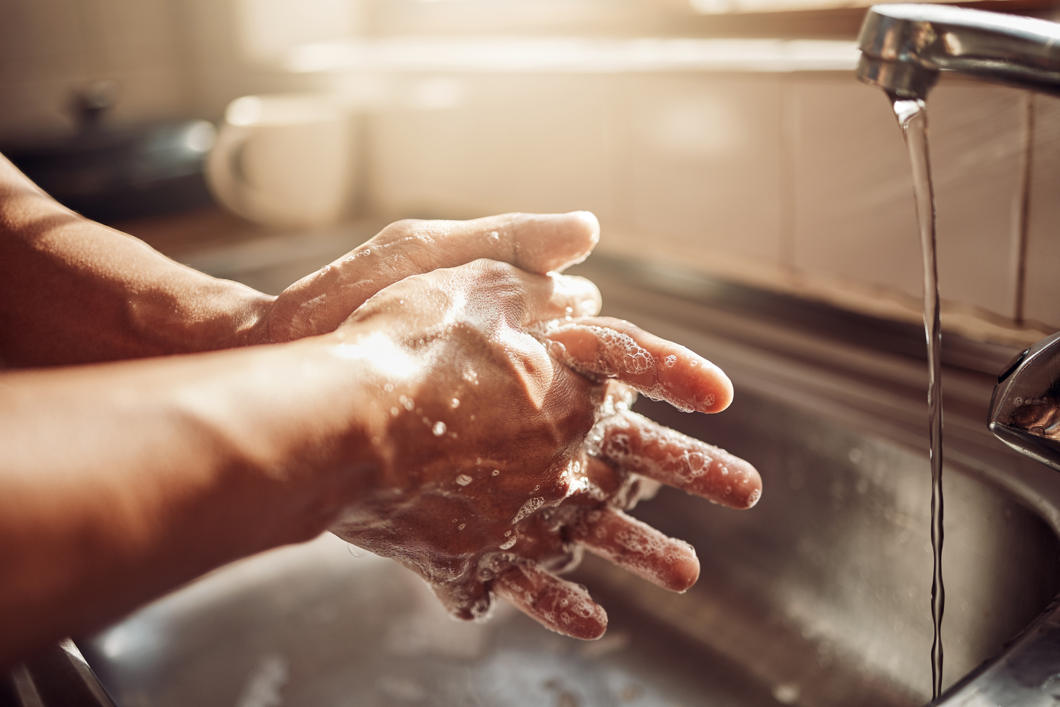 Washing hands at a sink