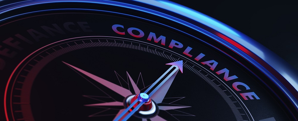 compass with arrow pointing to the word compliance