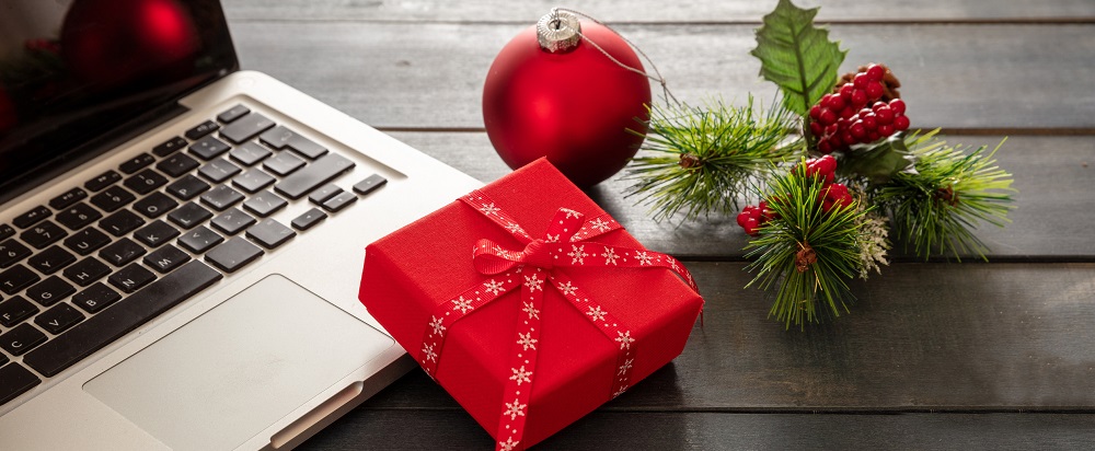 computer next to holiday decorations