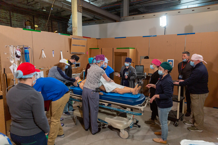 Colored hats are used to identify team members for post-scenario video analysis.