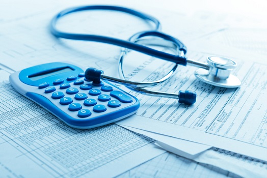Benefits - Calculator and Stethoscope on Desk