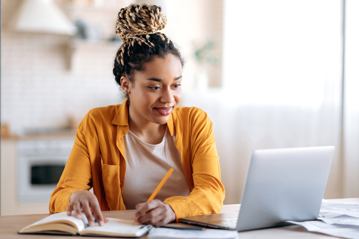 A women sitting in front of a computer.