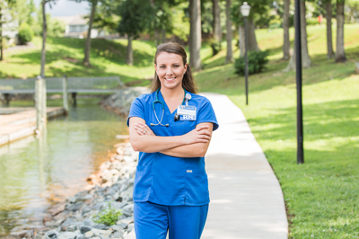 A Carilion registered nurse standing on a greenway.