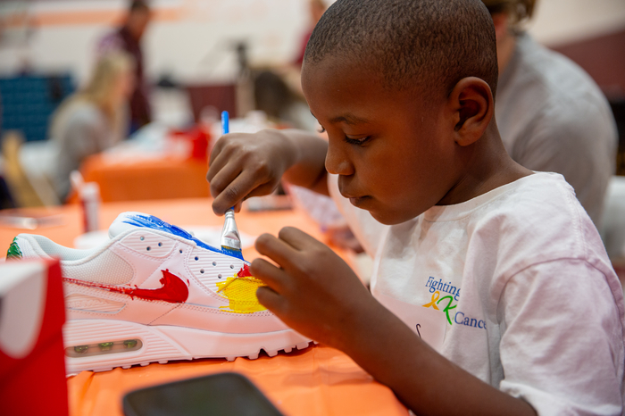 A pediatric patient focuses on creating one-of-a-kind kicks.