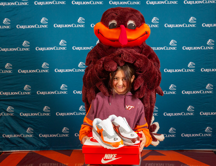 The HokieBird with a pediatric patient. 