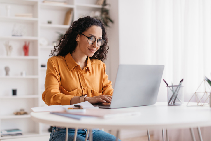 A woman sitting in front of a computer.