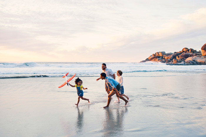 A young family on a beach vacation.