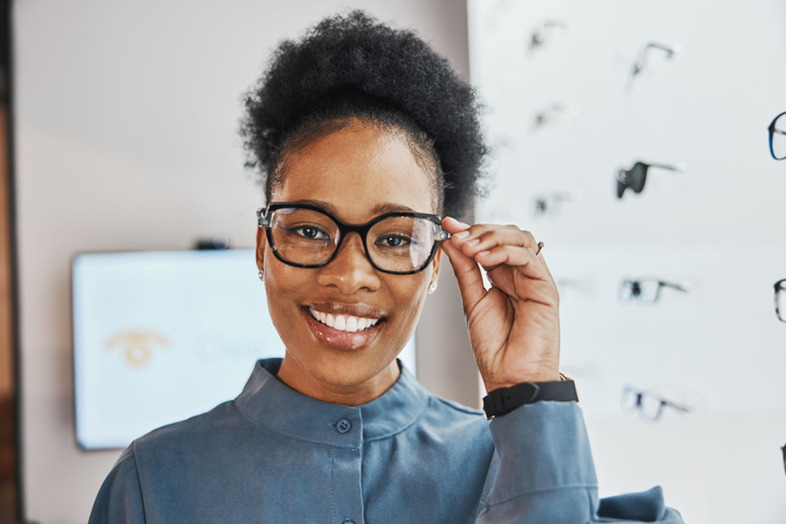 A woman trying on prescription glasses.
