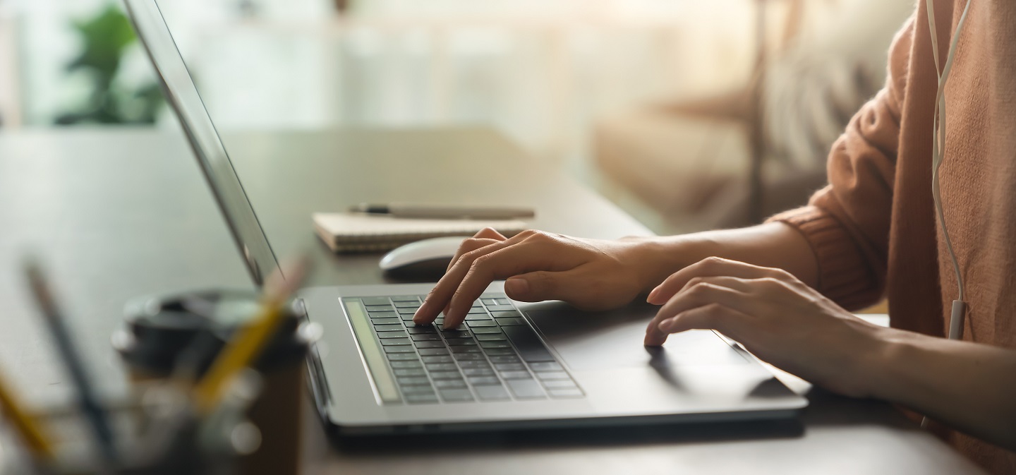 stock image of laptop in comfortable office