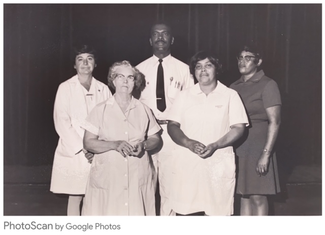 Douglas Martin receives his service award in 1974