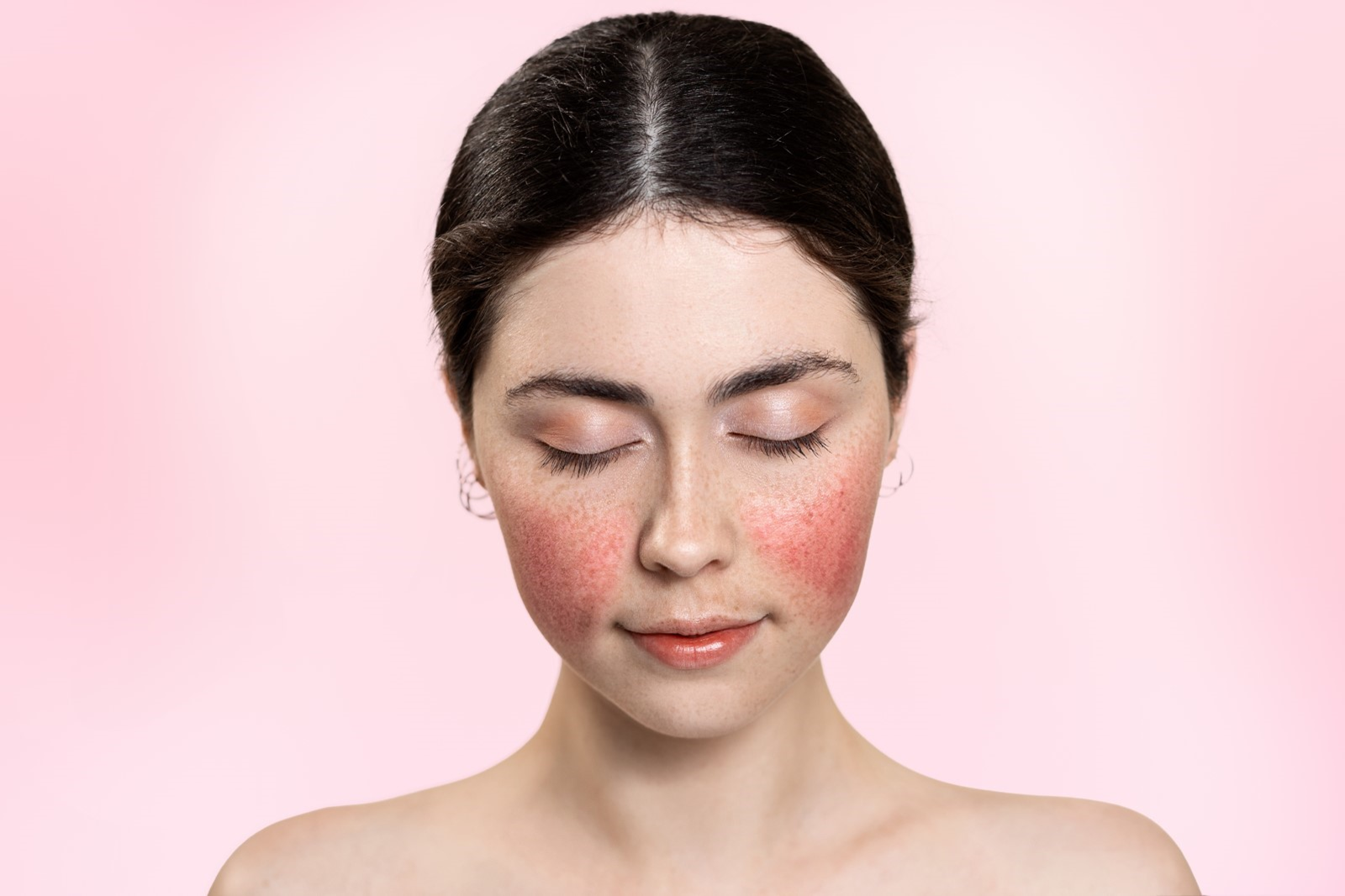 woman's face with red cheeks