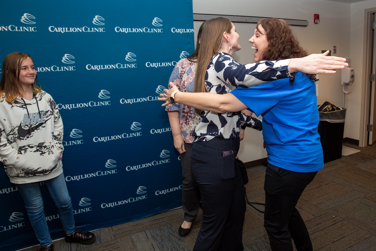 YES participant Laura Foretich hugging friends