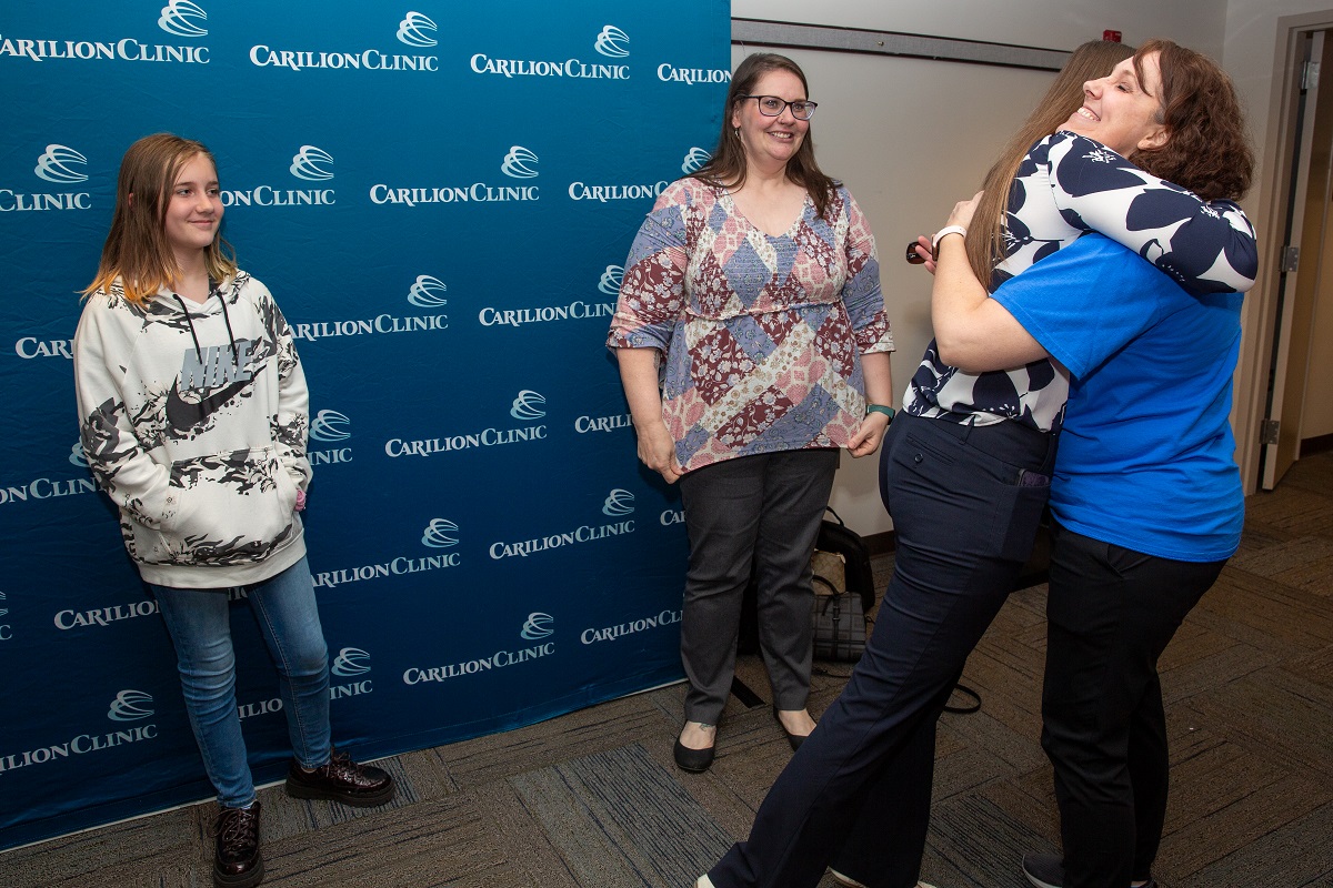 YES participant Laura Foretich hugging friends