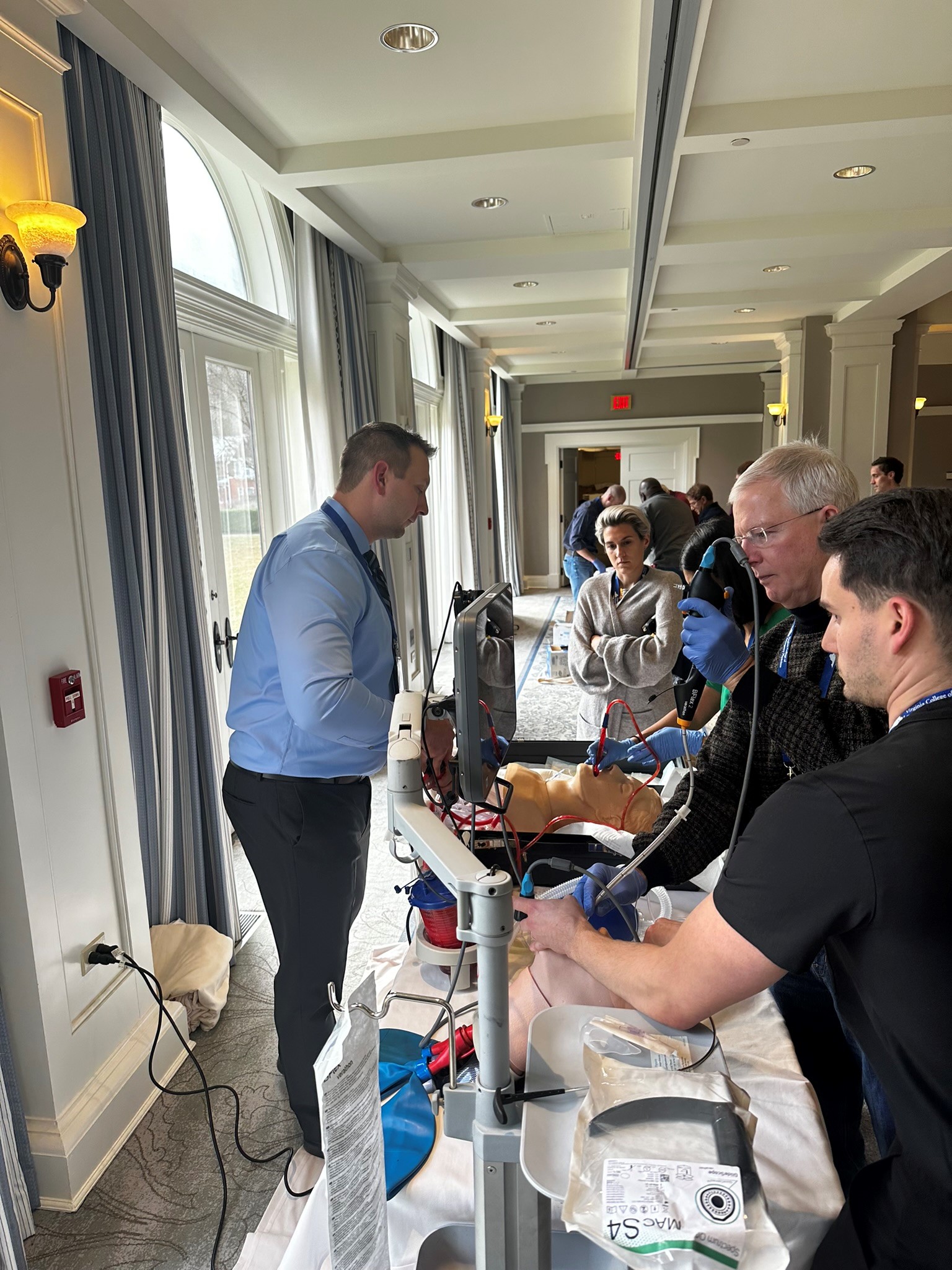 Emergency Medicine physicians train to perform cricothyrotomy.