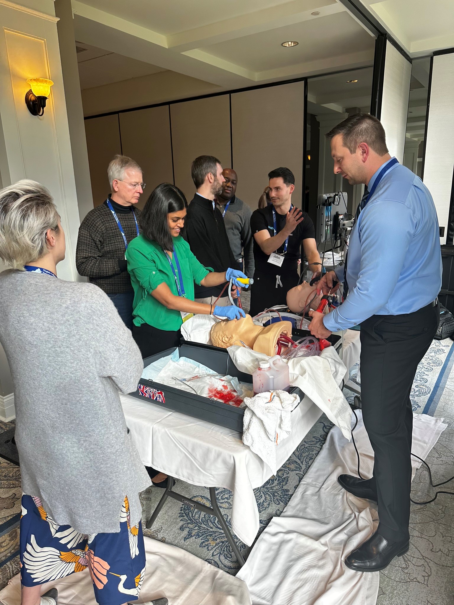 Emergency Medicine physicians train to perform cricothyrotomy.