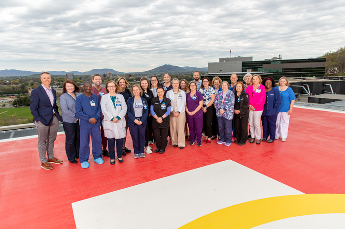 The CVI leadership team on the helipad