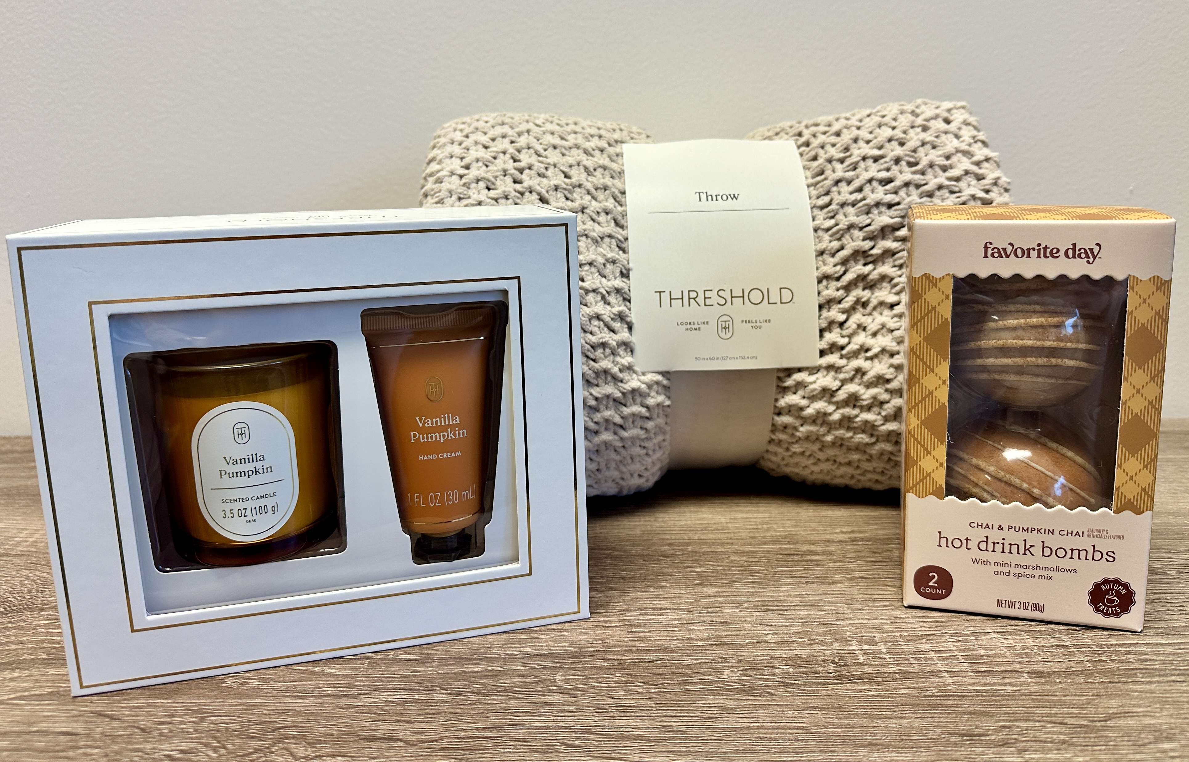 Crisp Air and Cozy Care: throw blanket, hot drink bombs, vanilla pumpkin candle and hand cream