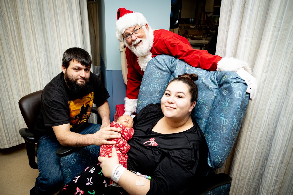 Santa greeting patient and family