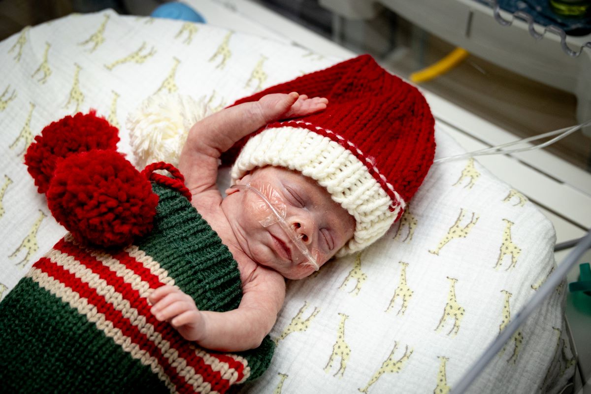 NICU patient dressed in a stocking