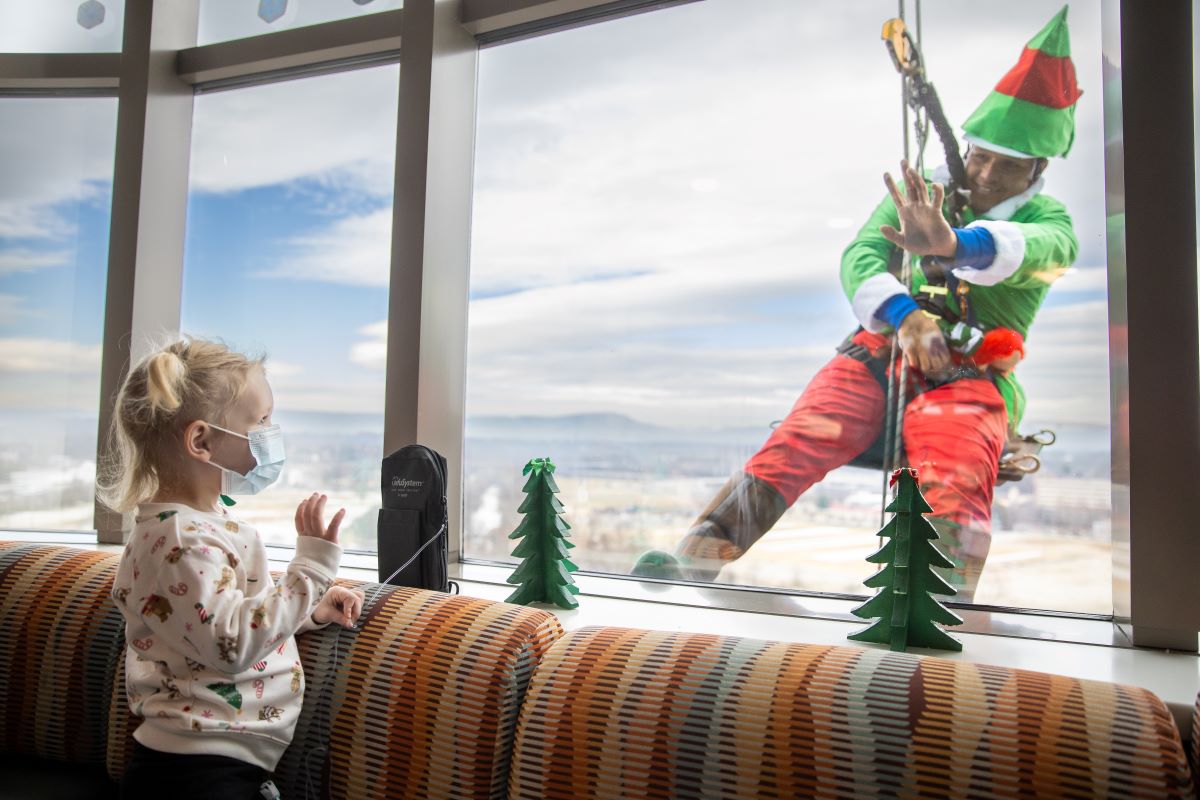 Elf waving at patient through window