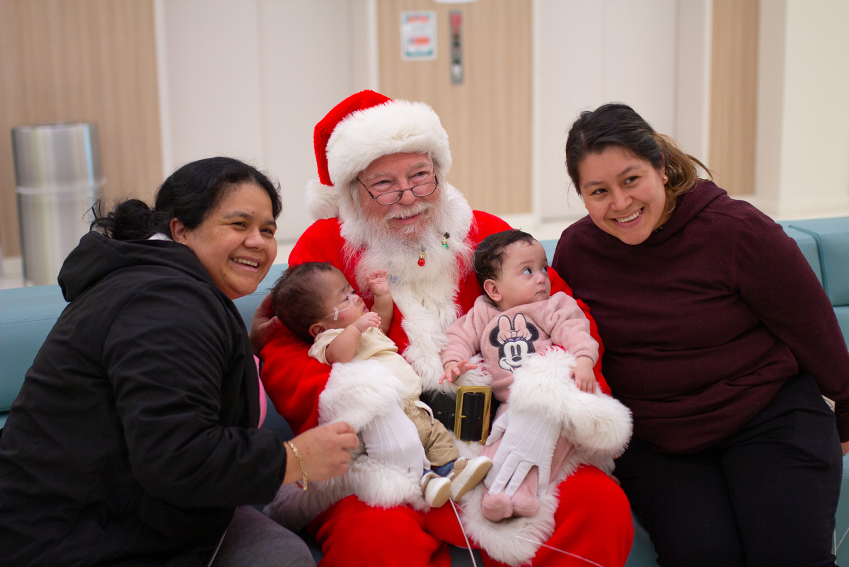 Santa greeting family