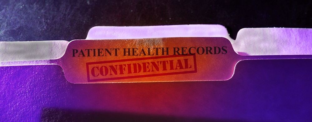 folder with the words "patient health records confidential"