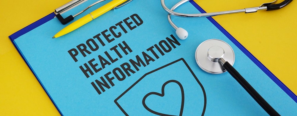 paper on clipboard that says protected health information