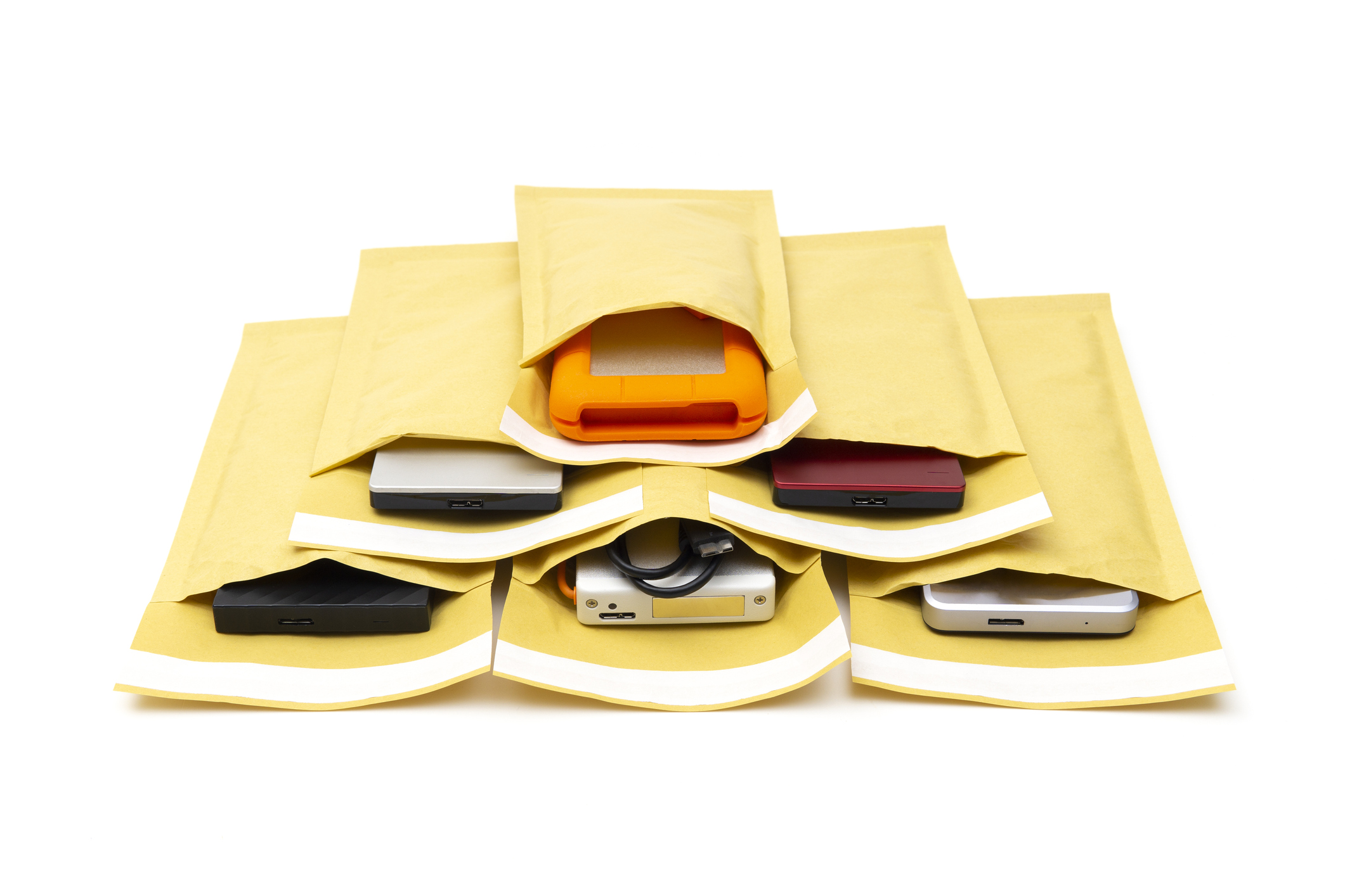 a variety of external drives in padded envelopes