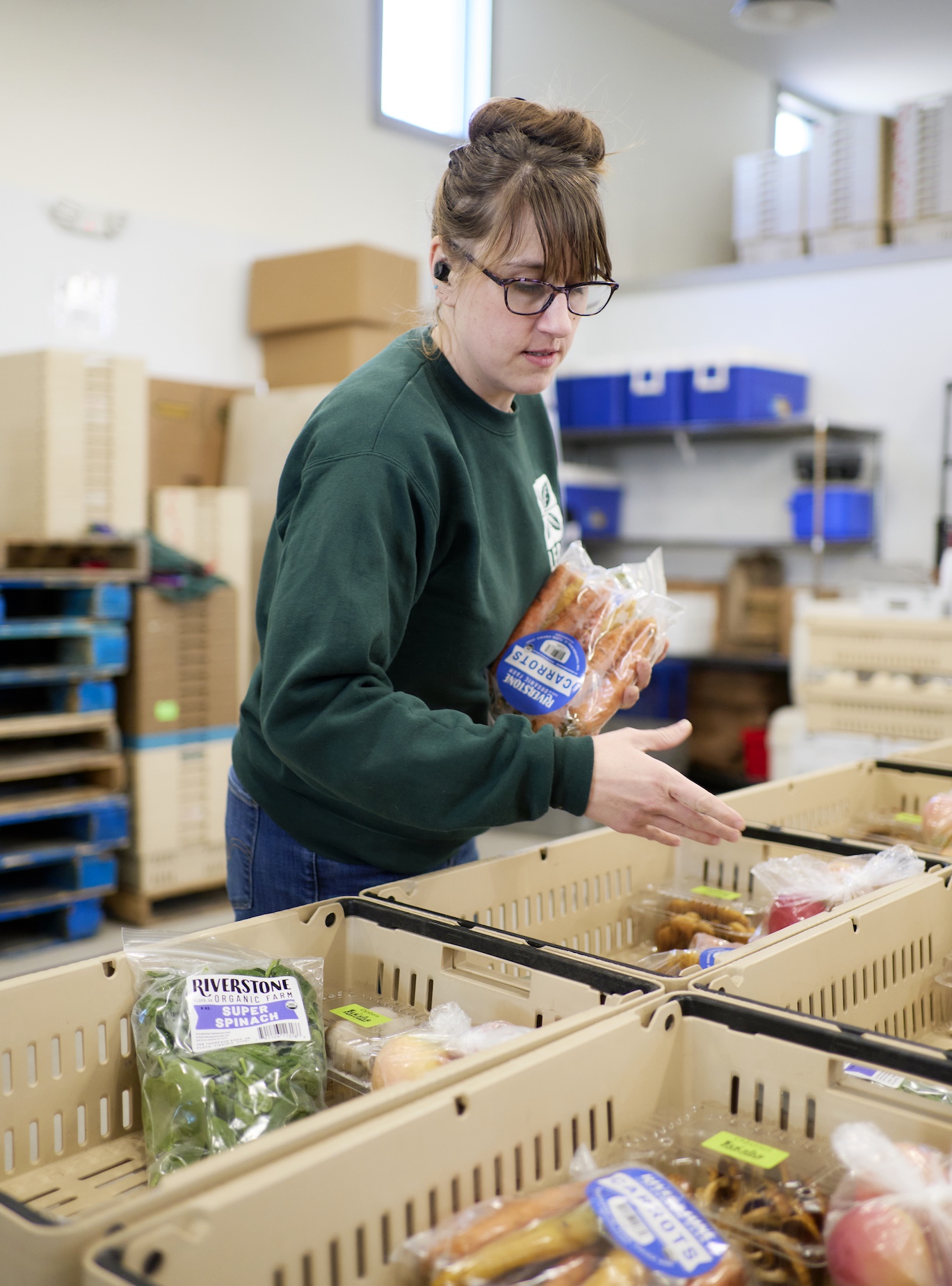 LEAP staff are available at several pickup sites to help pack produce and answer questions.