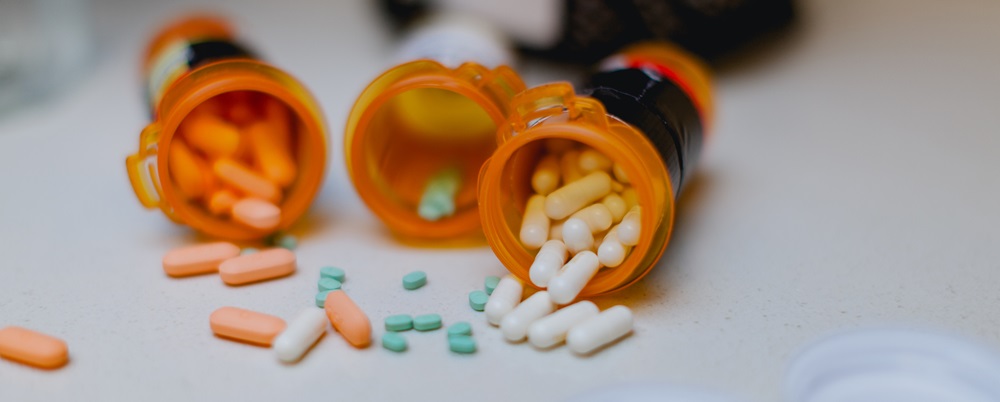 three pill bottles