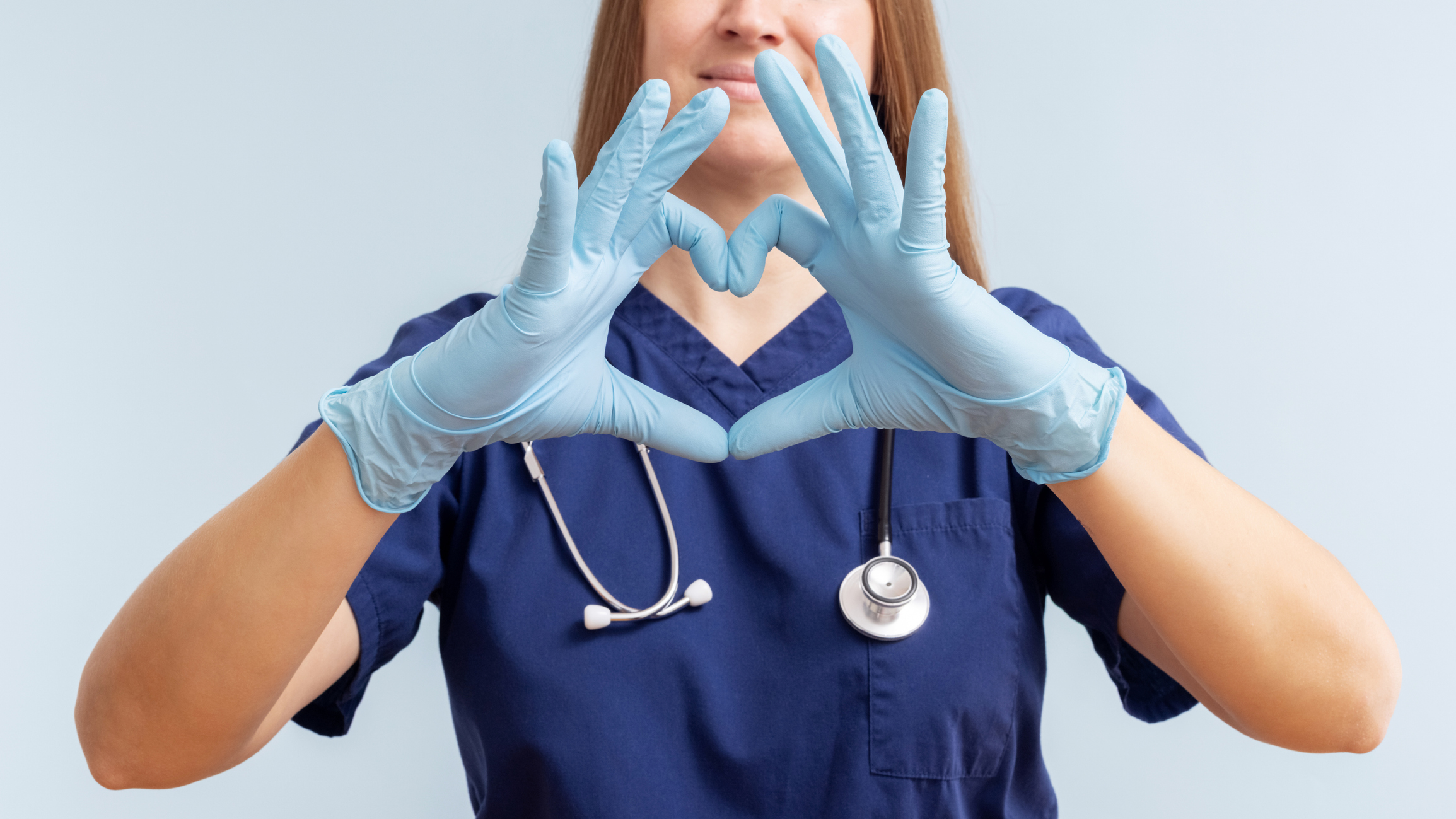 Nurse making a heart with hands