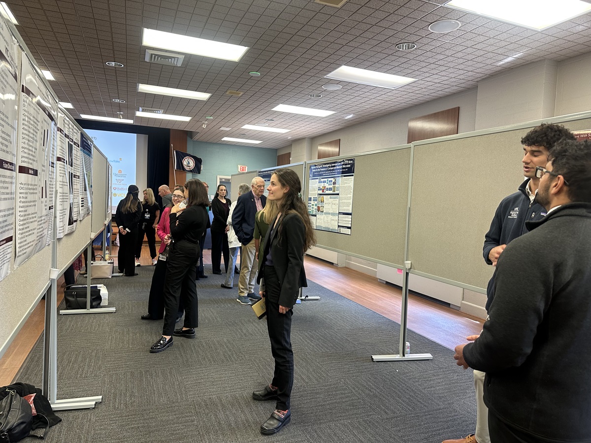 Research Day attendees view poster presentations.
