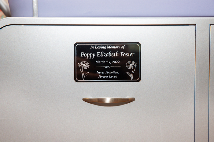 Plaque in memory of Poppy on the Caring Cradle.