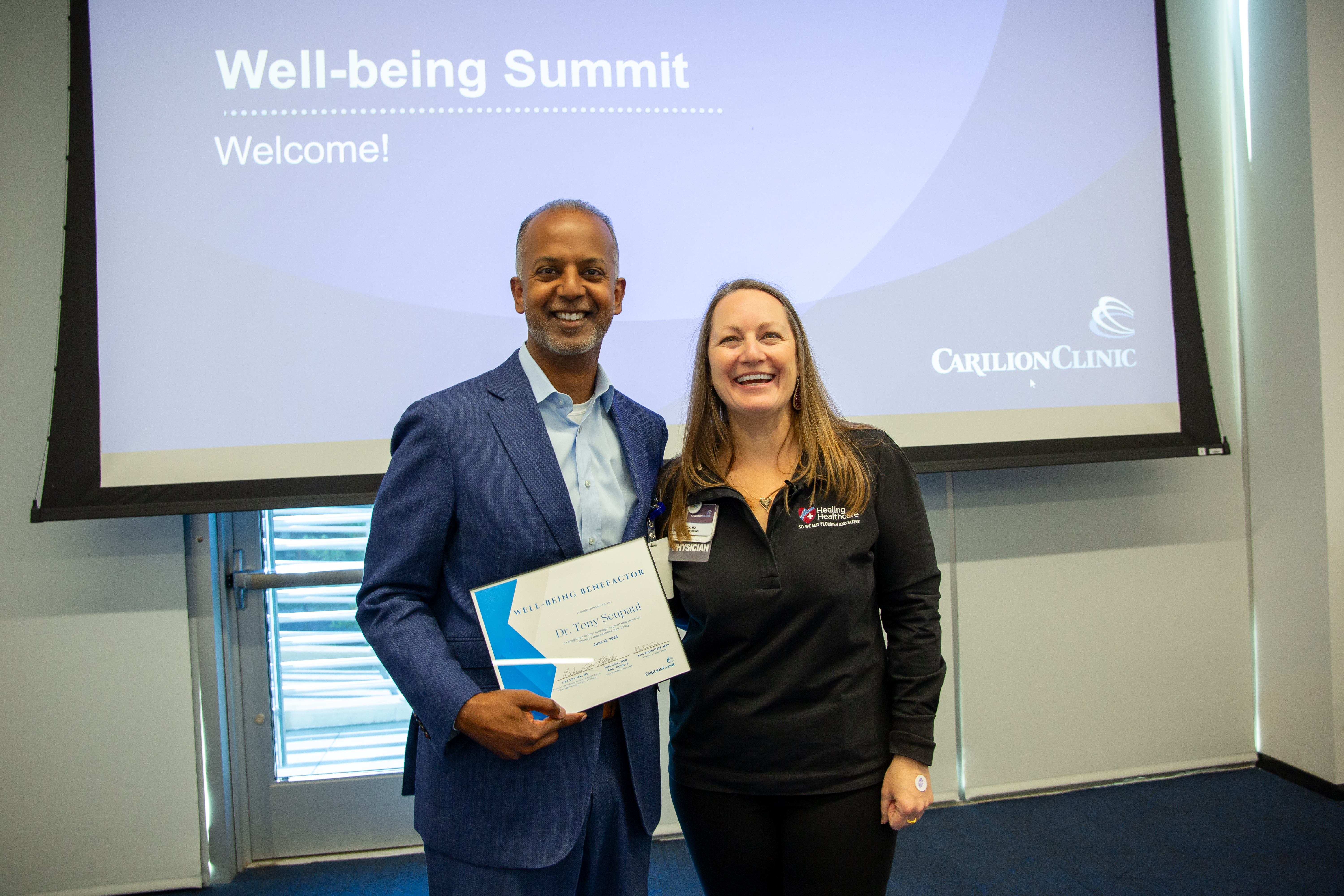 Dr. Tony Seupaul receiving the Well-Being Benefactor Award