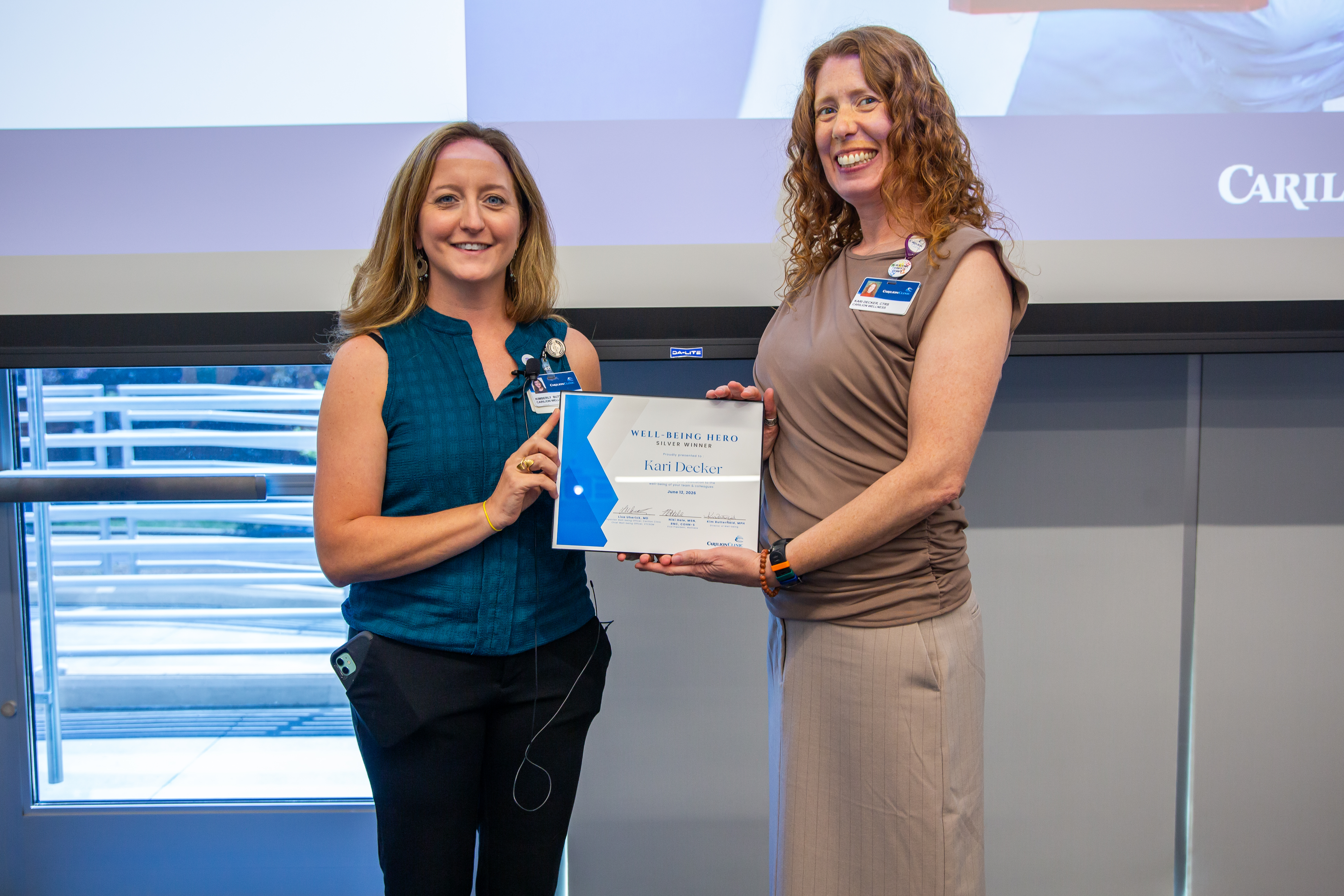 Kari Decker receiving the Well-Being Hero Silver Award