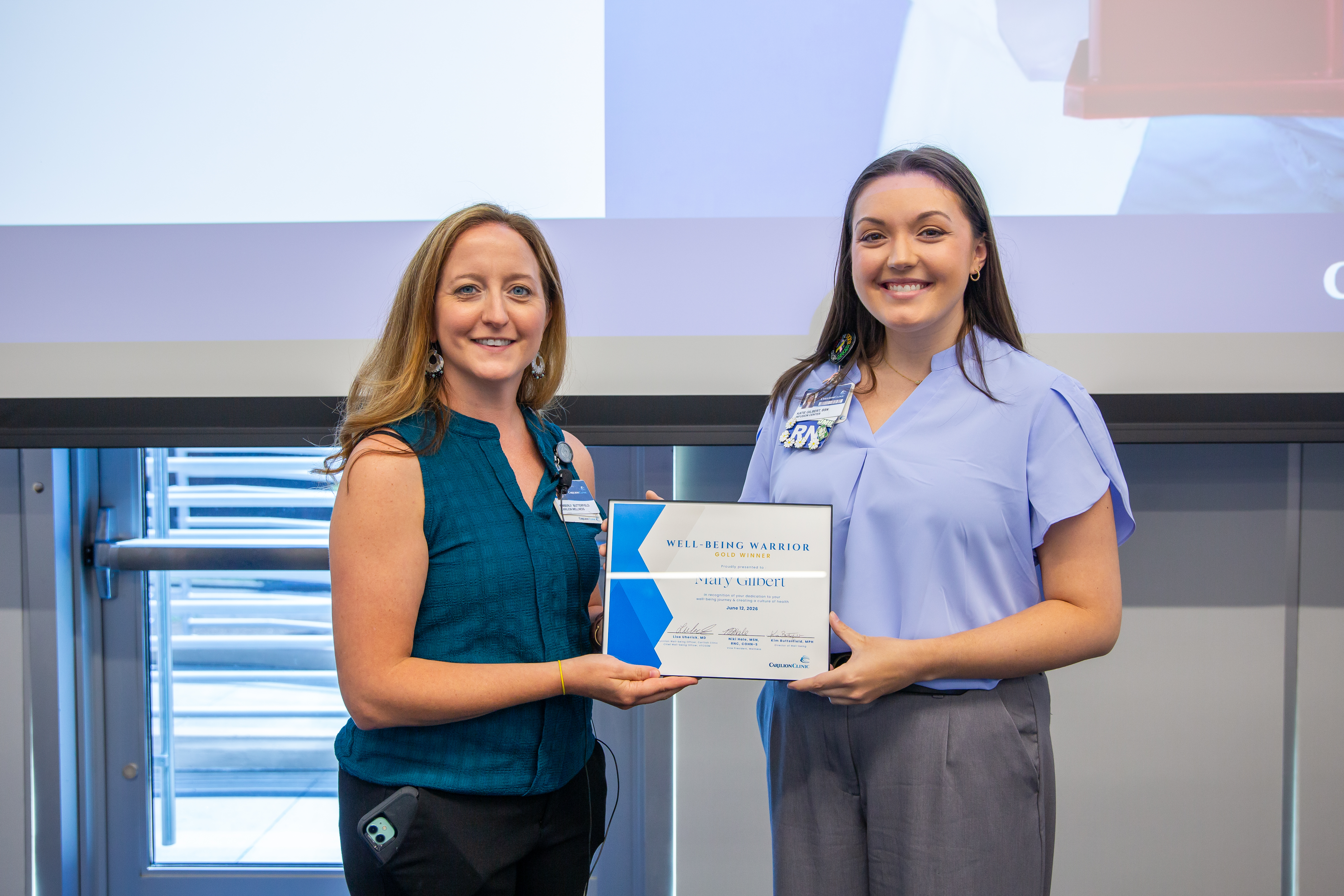 Mary Gilbert receiving the Well-Being Warrior Gold Award