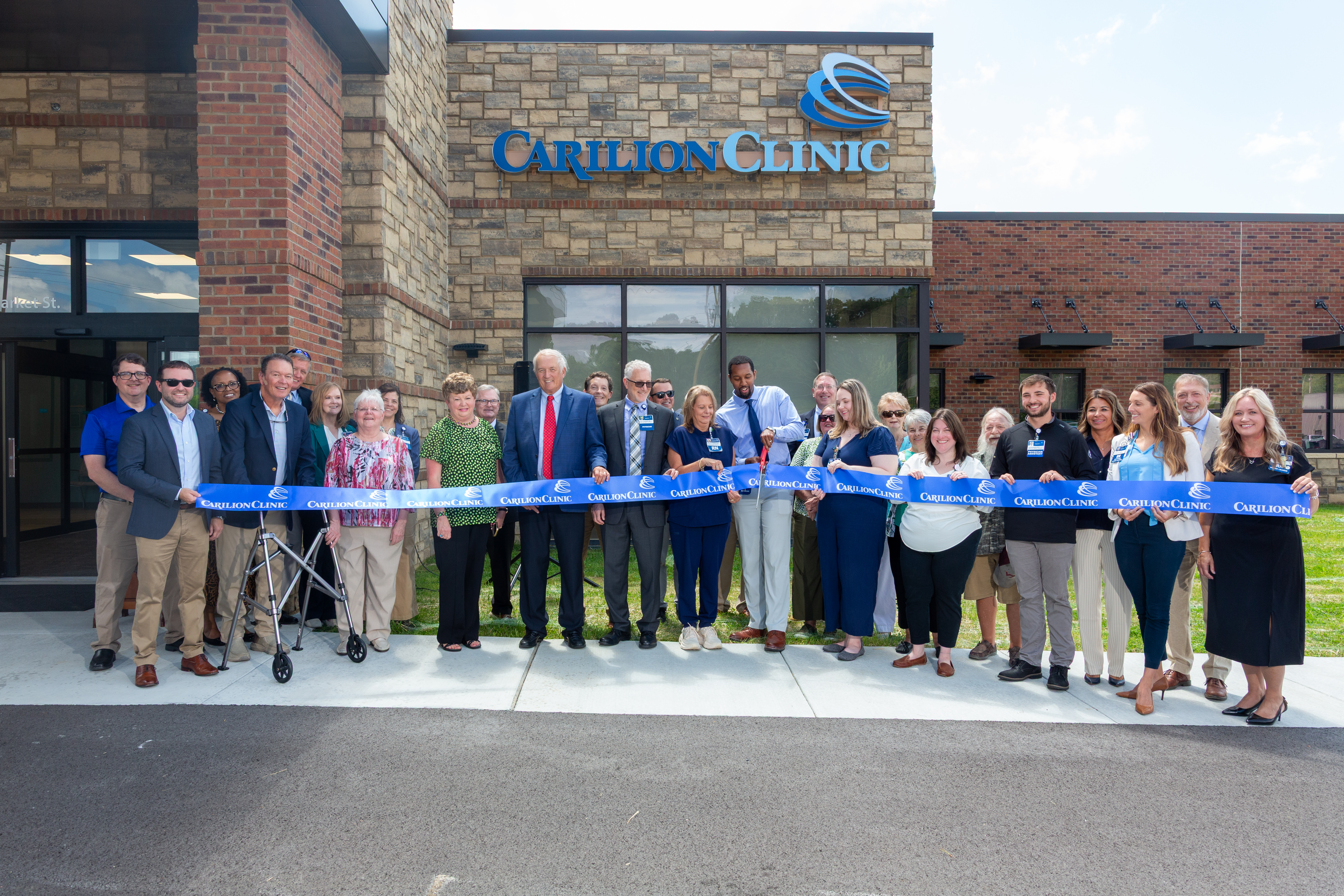Carilion leaders and community members cut the ribbon outside the new Tazewell Family Medicine location.