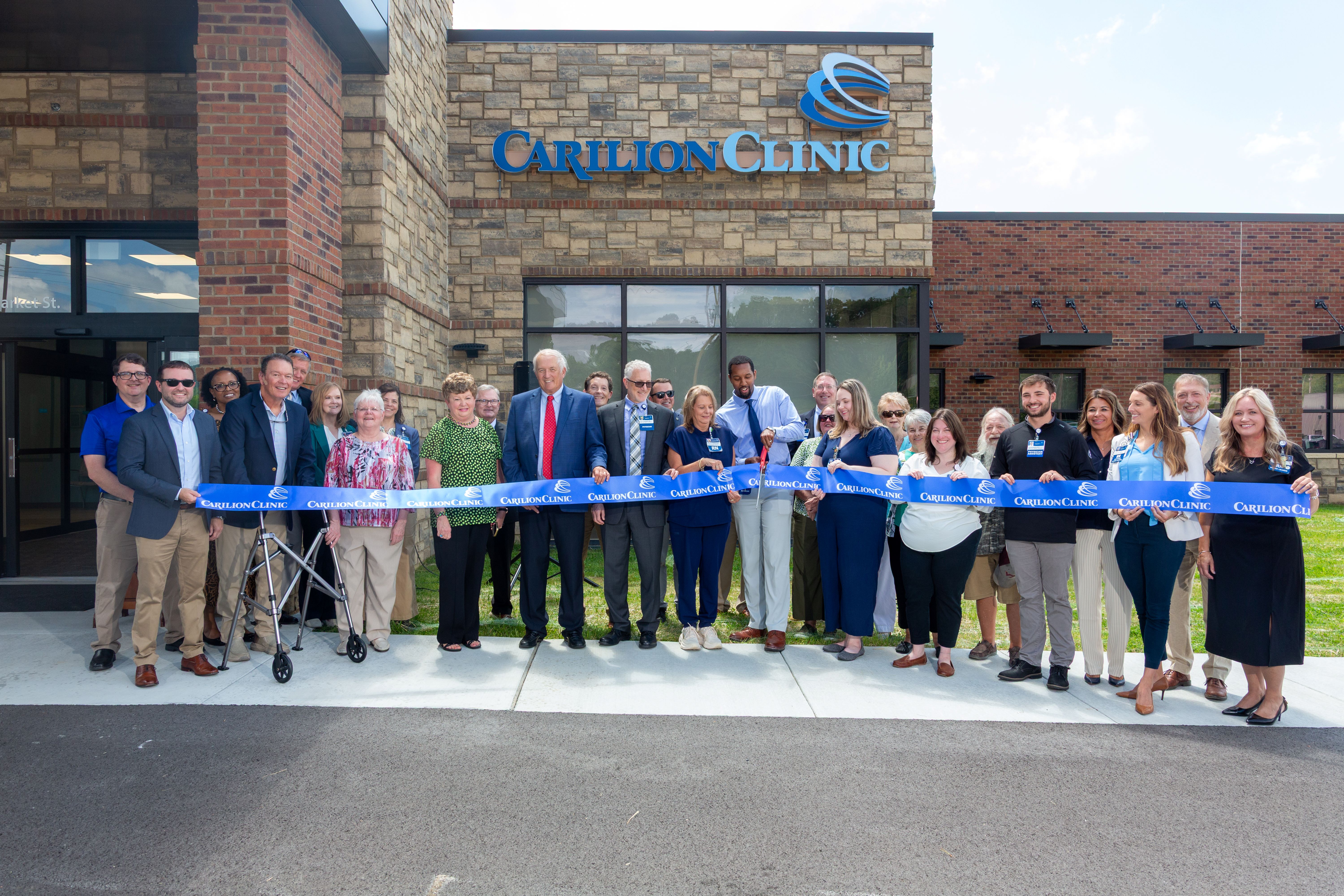 Carilion leaders and community members cut the ribbon outside the new Tazewell Family Medicine location.