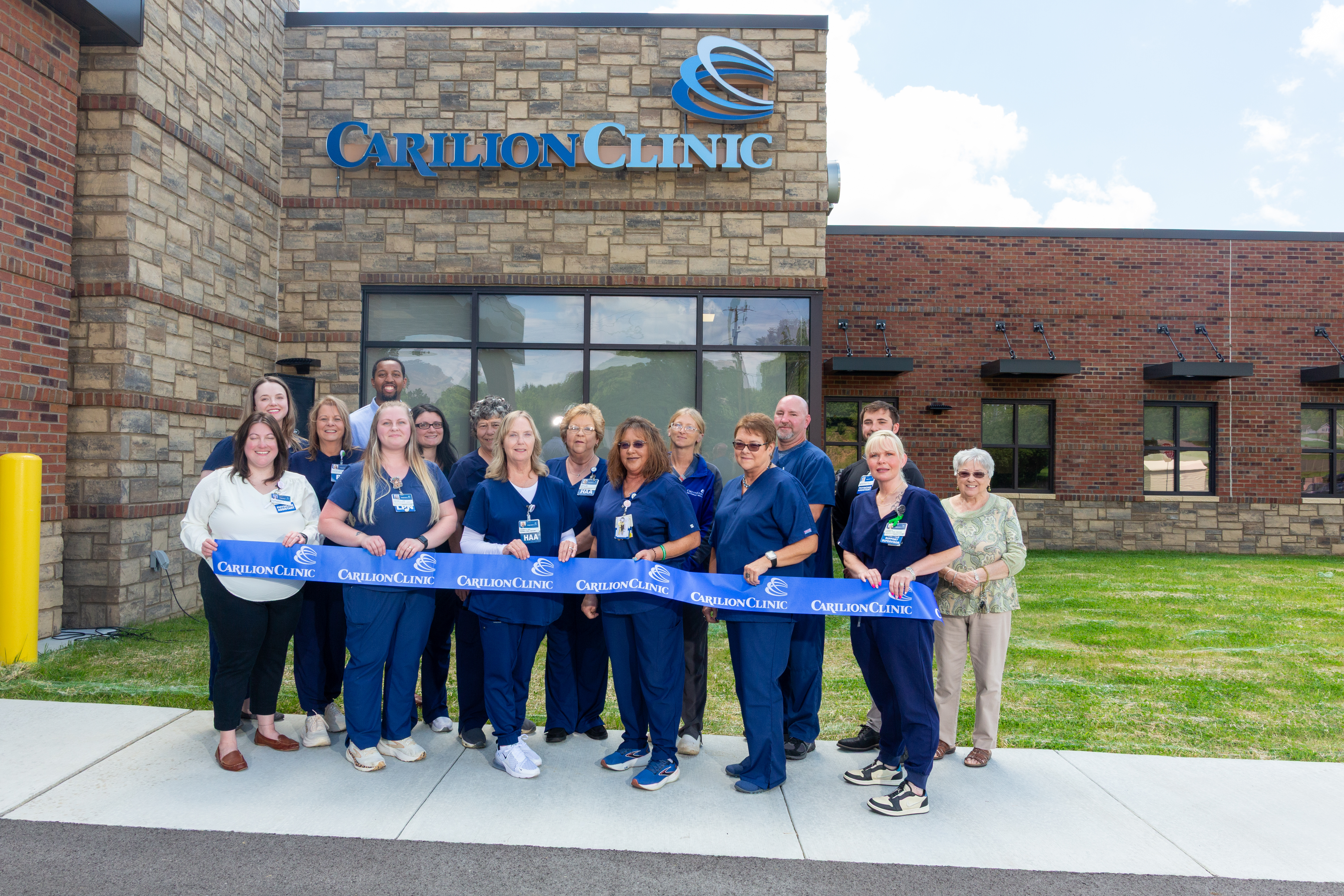 Carilion Family and Community Medicine team members cut the ribbon outside the new Tazewell Family Medicine location.
