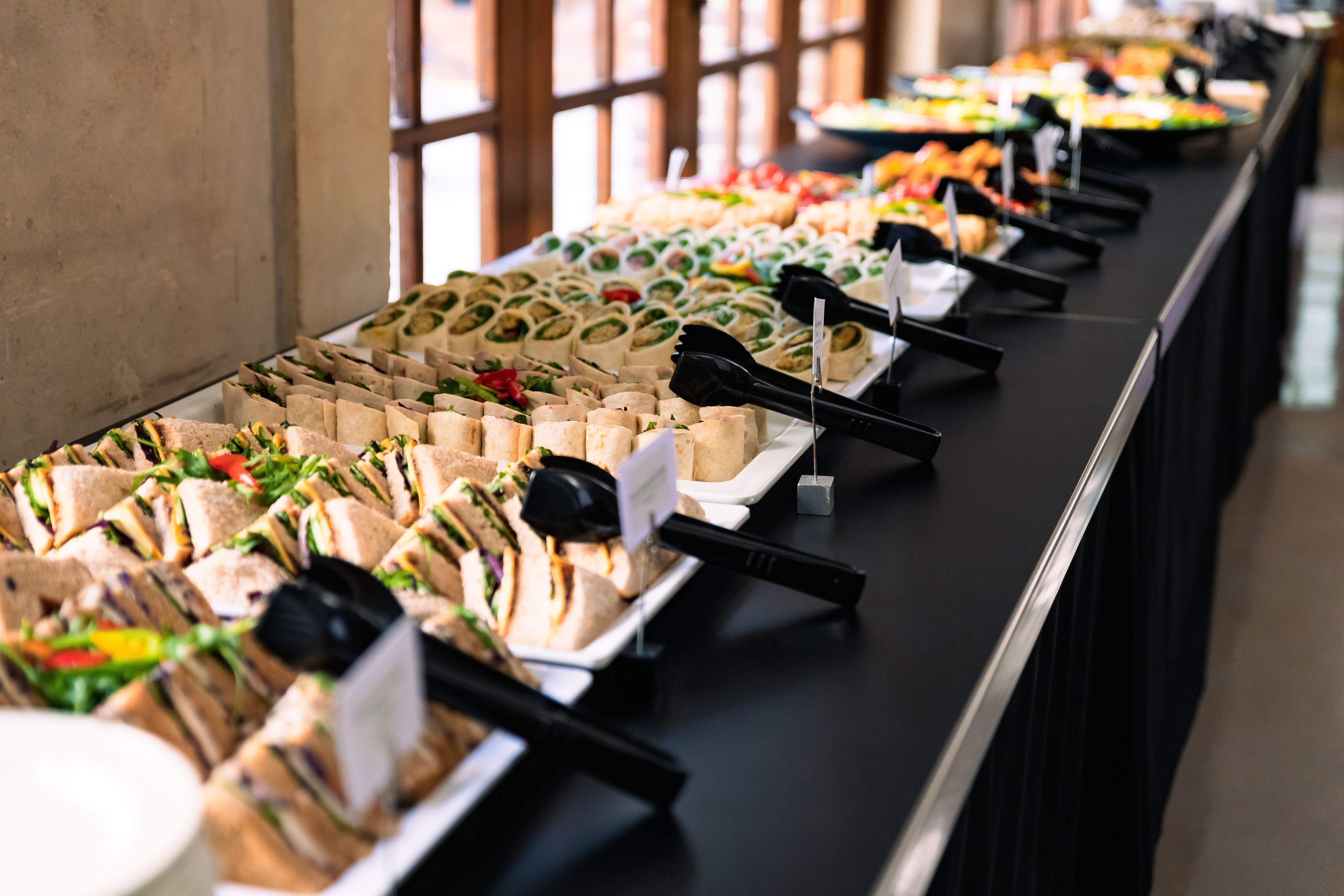 A table displaying an assortment of catered food.