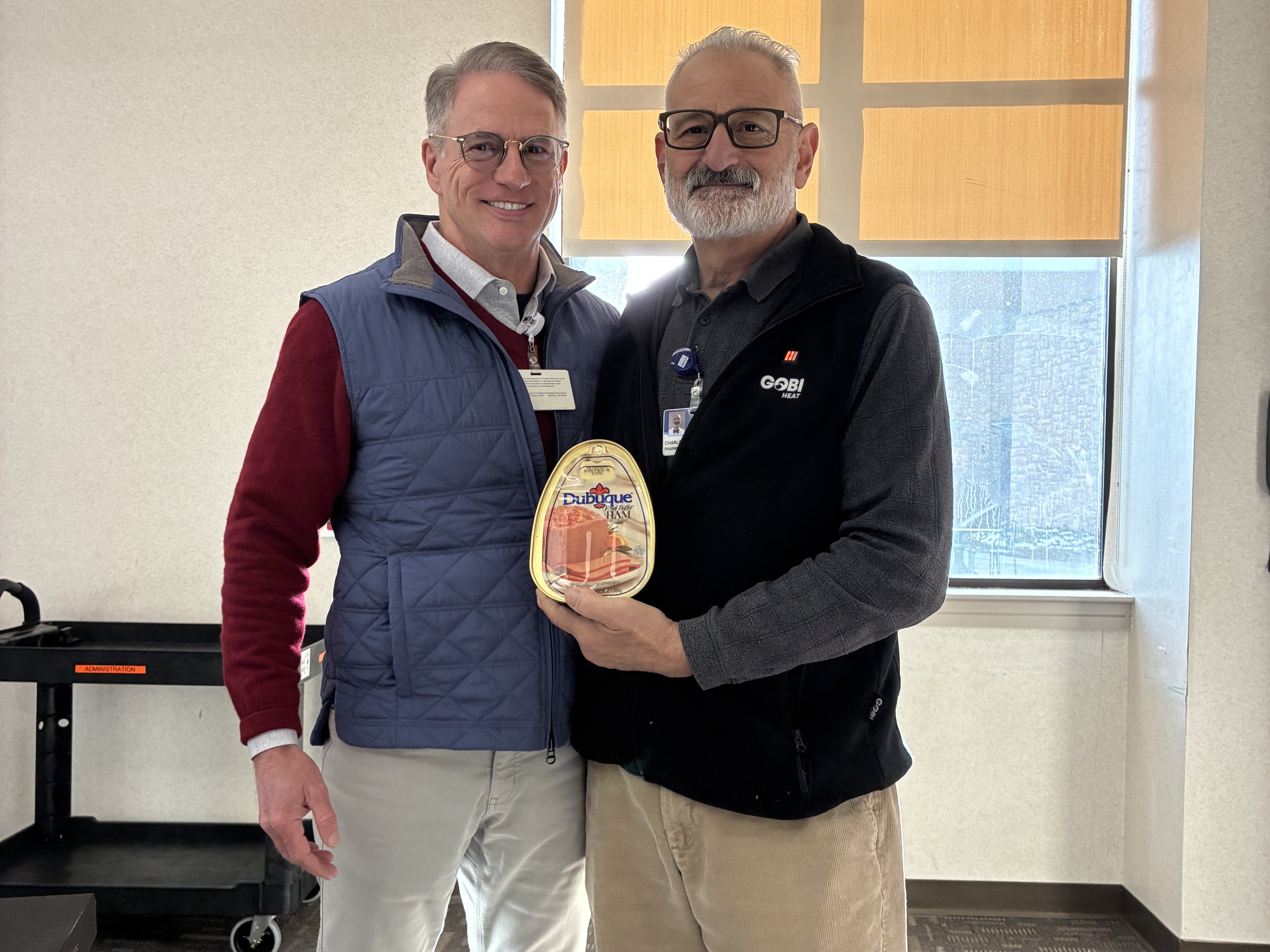Bill Flattery and Charlie Tarasidis with a canned ham donation