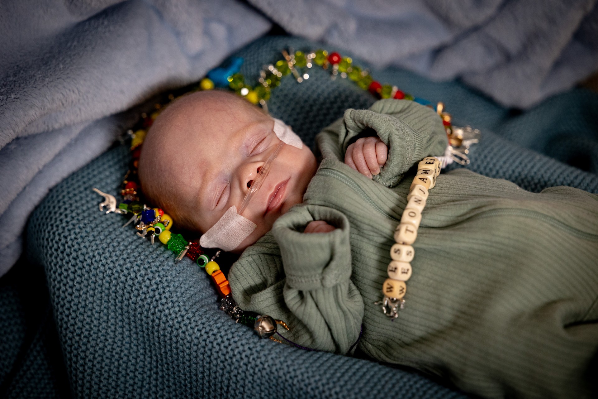 Weston laying with NICU Beads