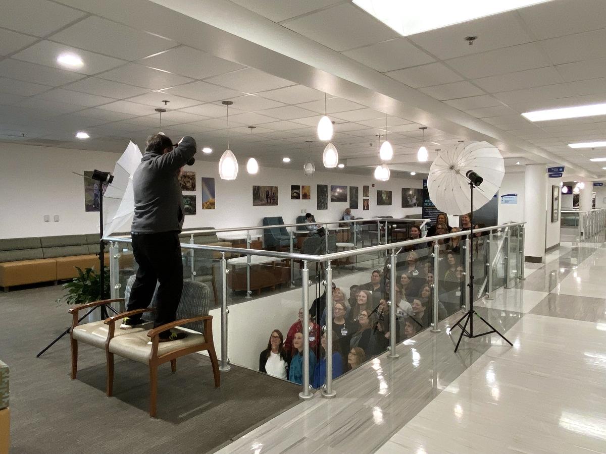 Scott Yates taking photo of Neurosurgery team