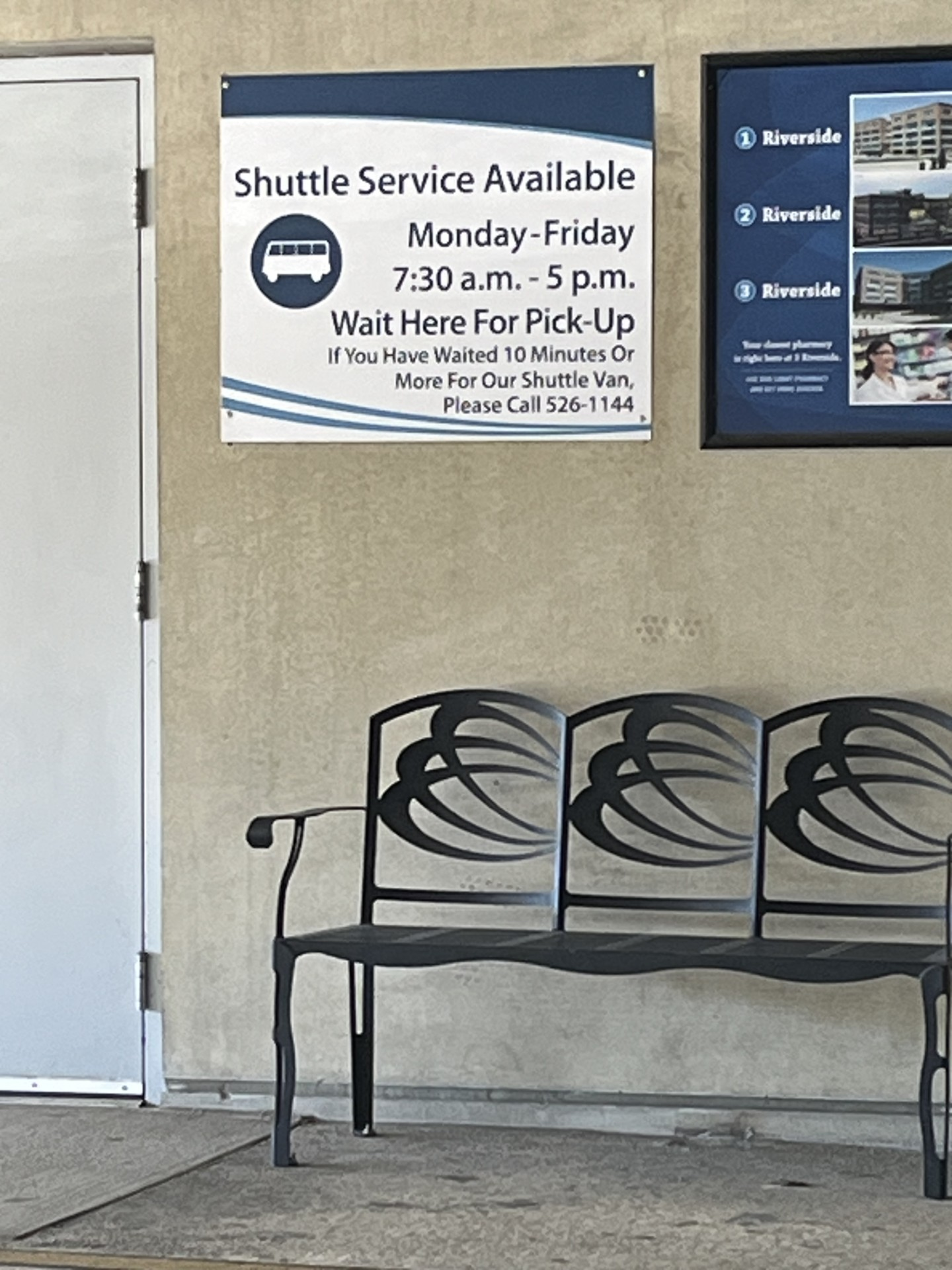 Sign for shuttle at a shuttle stop