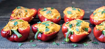 Stuffed peppers on a baking tray.