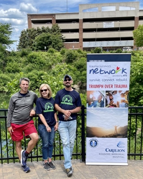 trauma team with Trauma Survivors Network sign