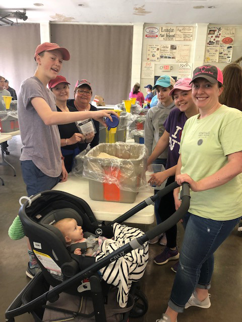 packing food for Rise Against Hunger