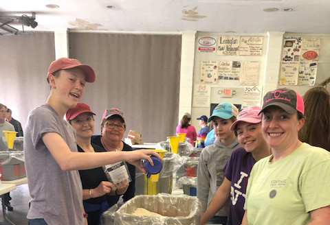 packing food for Rise Against Hunger