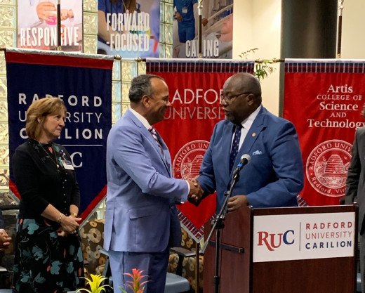 Dr. NL Bishop receiving the key to the city from Mayor Sherman P.  Lea, Sr. 